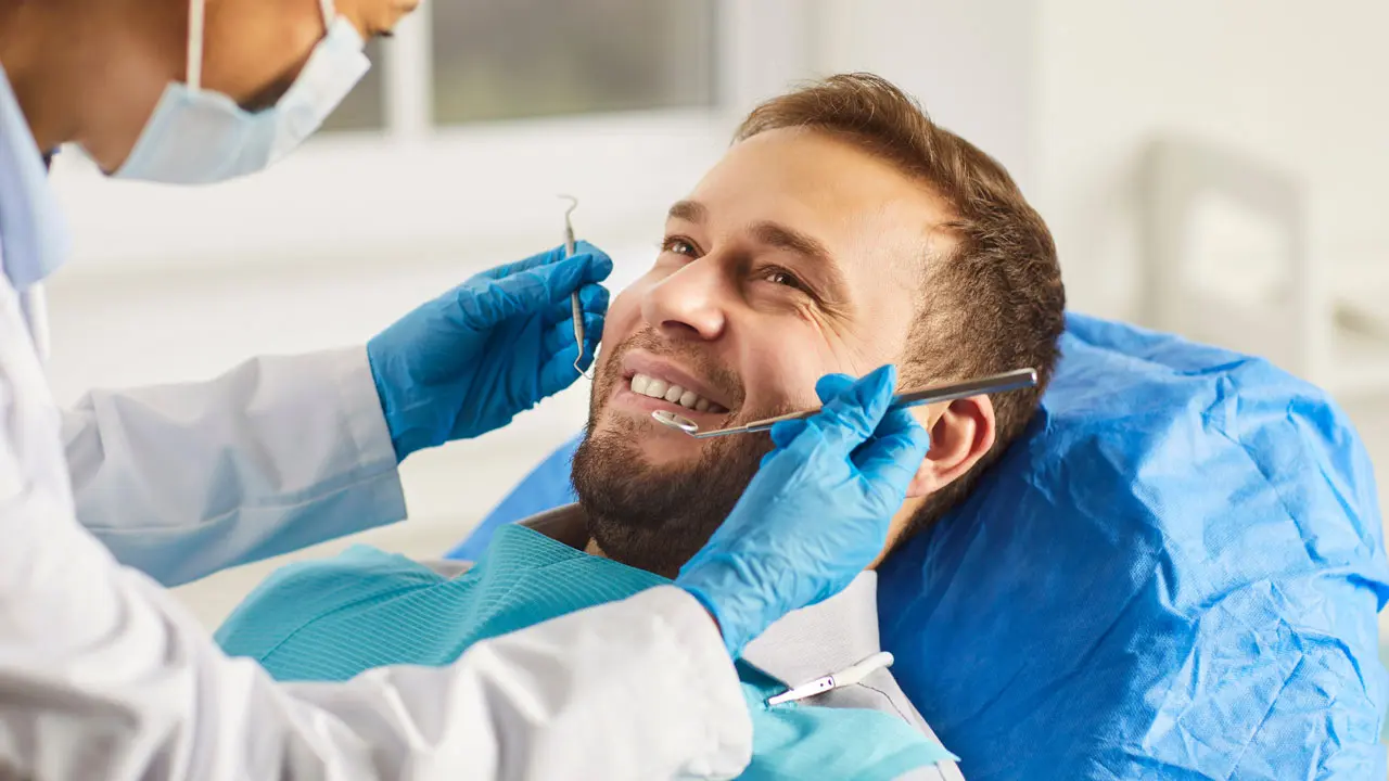 A man sitting in a Crestwood Dental chair keeping up with his oral health in 2026